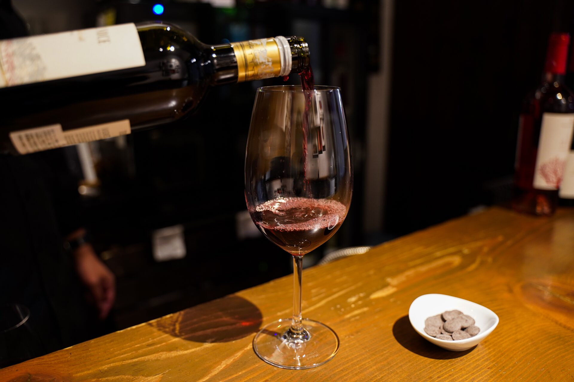 Wine being poured at Wine Kura